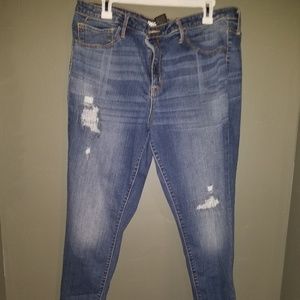 Medium wash distressed hem jeans NWOT